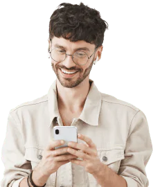 excited handsome young man using mobile phone looking happy